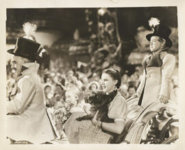 WIZARD OF OZ, THE (1939) Dorothy rides in Munchkins carriage