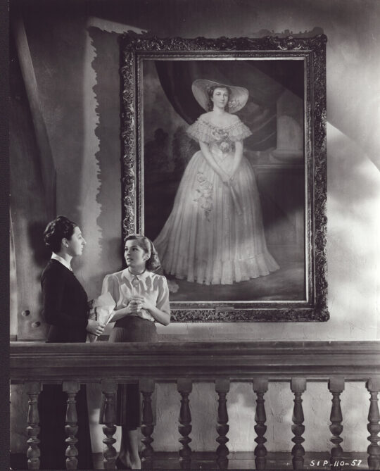 REBECCA WITH PAINTING | REBECCA (1940) Photo